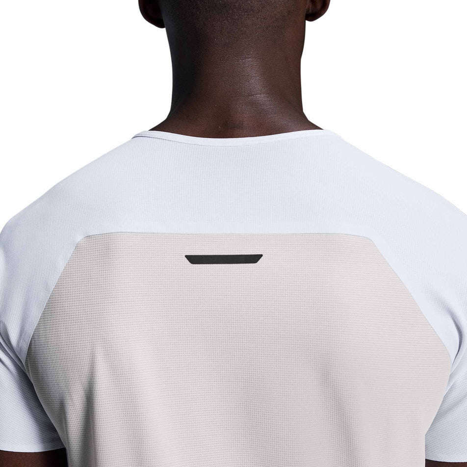 Back view of a model wearing the On Men's Performance-T in the White/Silver colourway. (8715745951906)
