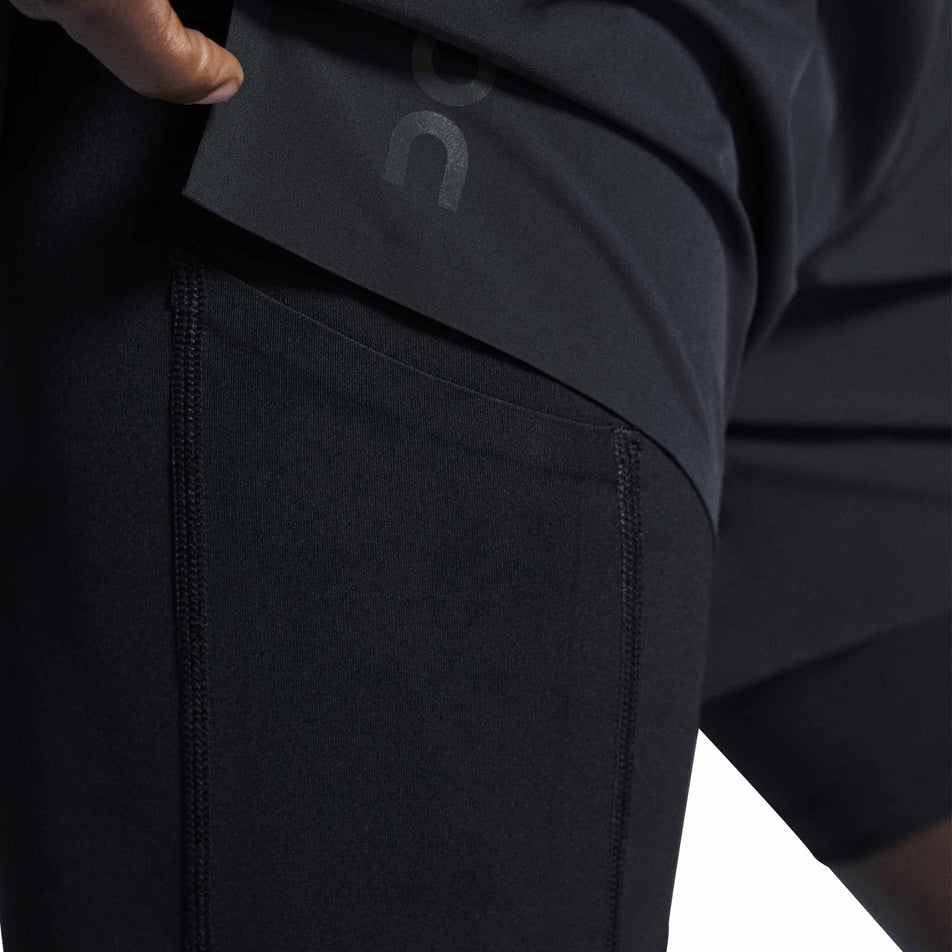 Side view of a model wearing the On Men's 5