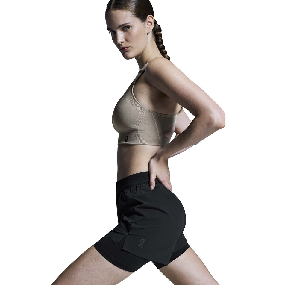 Side view of a model wearing the On Women's 3