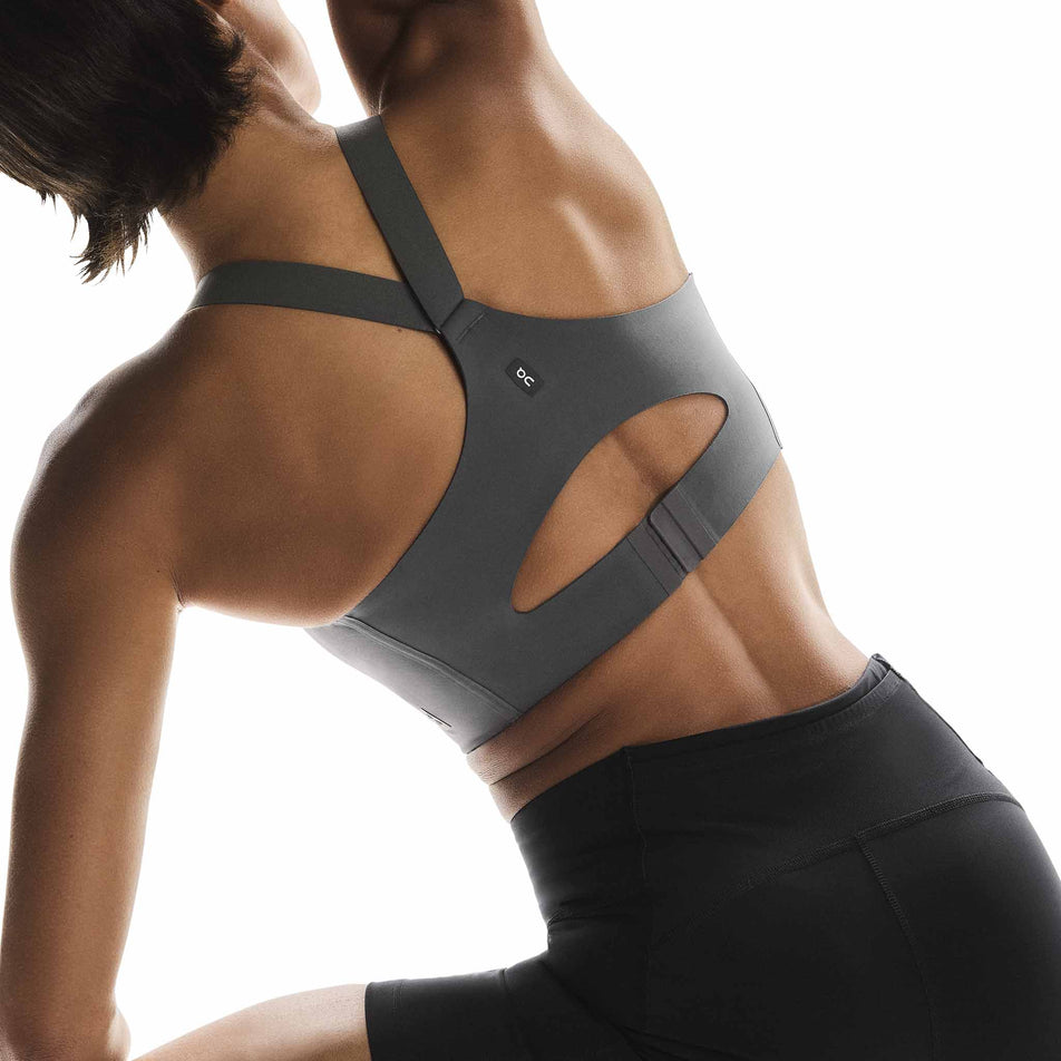 Back view of a model wearing the On Women's Endurance Bra Zip in the Eclipse colourway. (8715662426274)