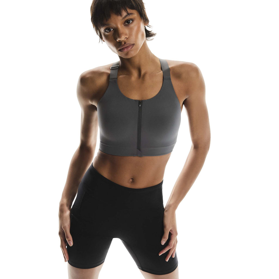 Front view of a model wearing the On Women's Endurance Bra Zip in the Eclipse colourway. (8715662426274)