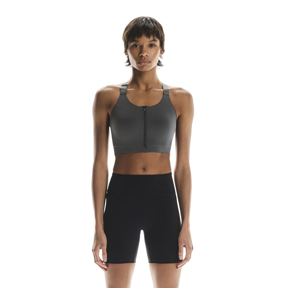 Front view of a model wearing the On Women's Endurance Bra Zip in the Eclipse colourway. (8715662426274)