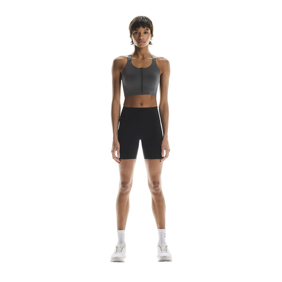 Front view of a model wearing the On Women's Endurance Bra Zip in the Eclipse colourway. (8715662426274)
