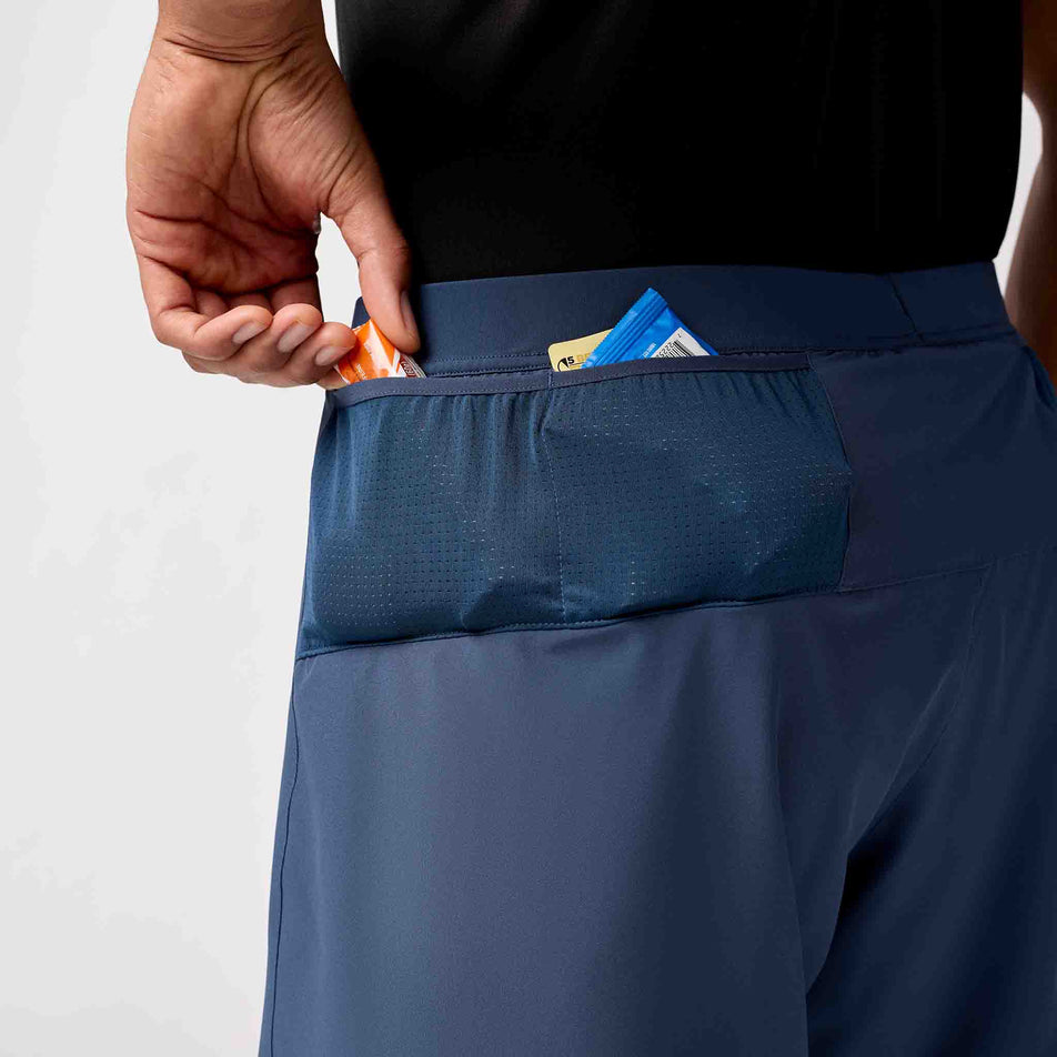 The stash pocket on the side of the Brooks Men's Journey 7