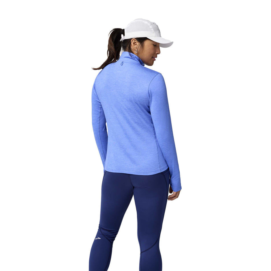 Back view of a model wearing the Brooks Women's Dash 1/2 Zip 2.0 in the Htr Bluebell colourway. (8575029280930)