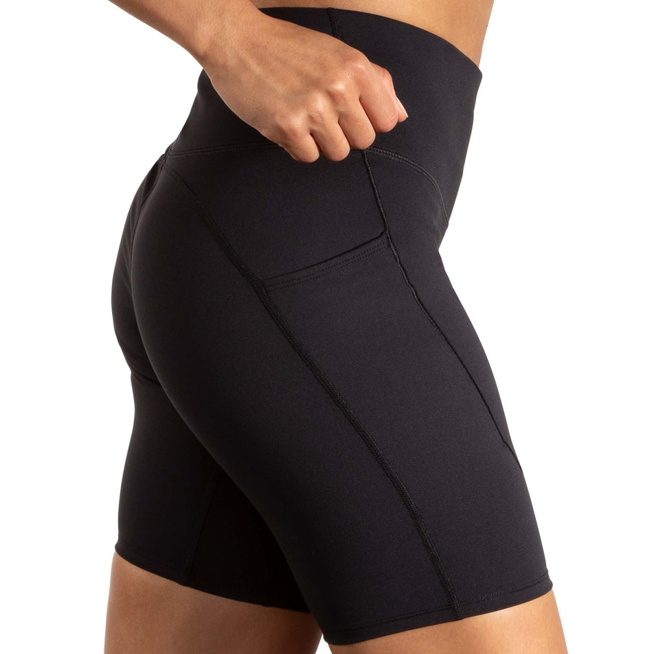 Side view of a model wearing the Brooks Women's Spark 8