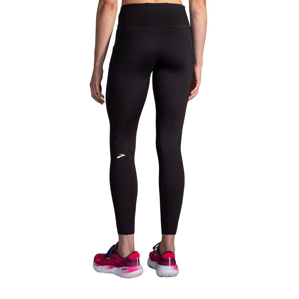 Back view of a model wearing the Brooks Women's Spark Tight in the Black colourway. (8718911406242)