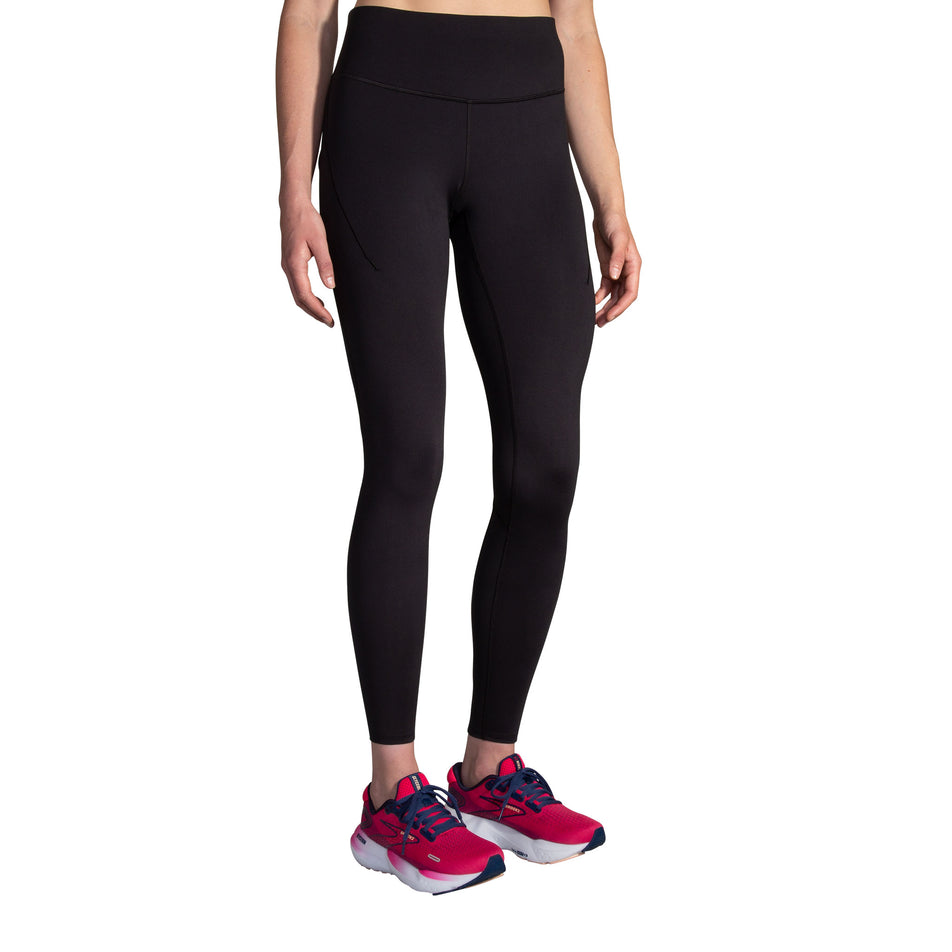 Front view of a model wearing the Brooks Women's Spark Tight in the Black colourway. (8718911406242)