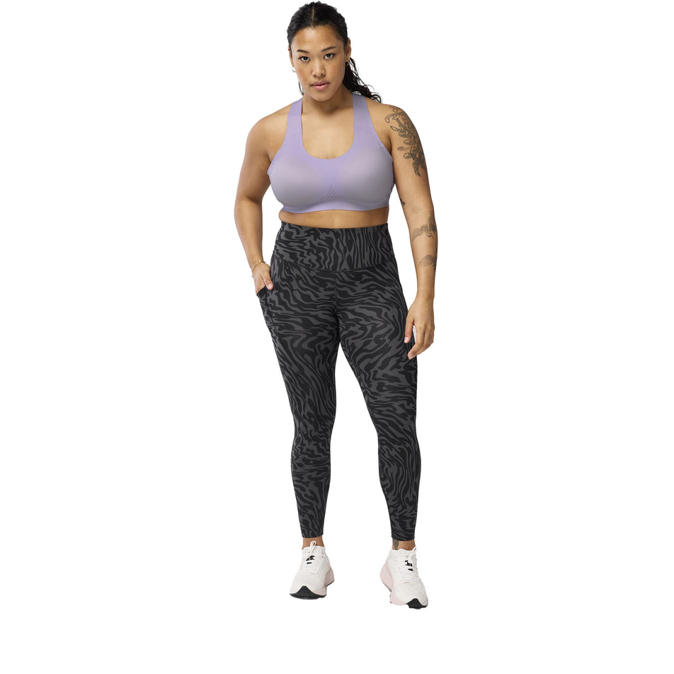 Front view of a model wearing the Brooks Women's Spark Tight in the Obsidian Speedscape colourway. (8575025152162)