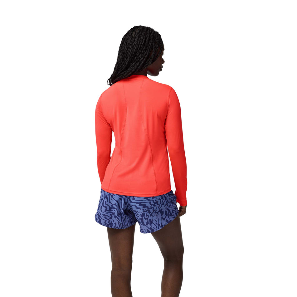 Back view of a model wearing the Brooks Women's Sprint Free Long Sleeve 3.0 in the Neo Cayenne colourway. (8575027282082)