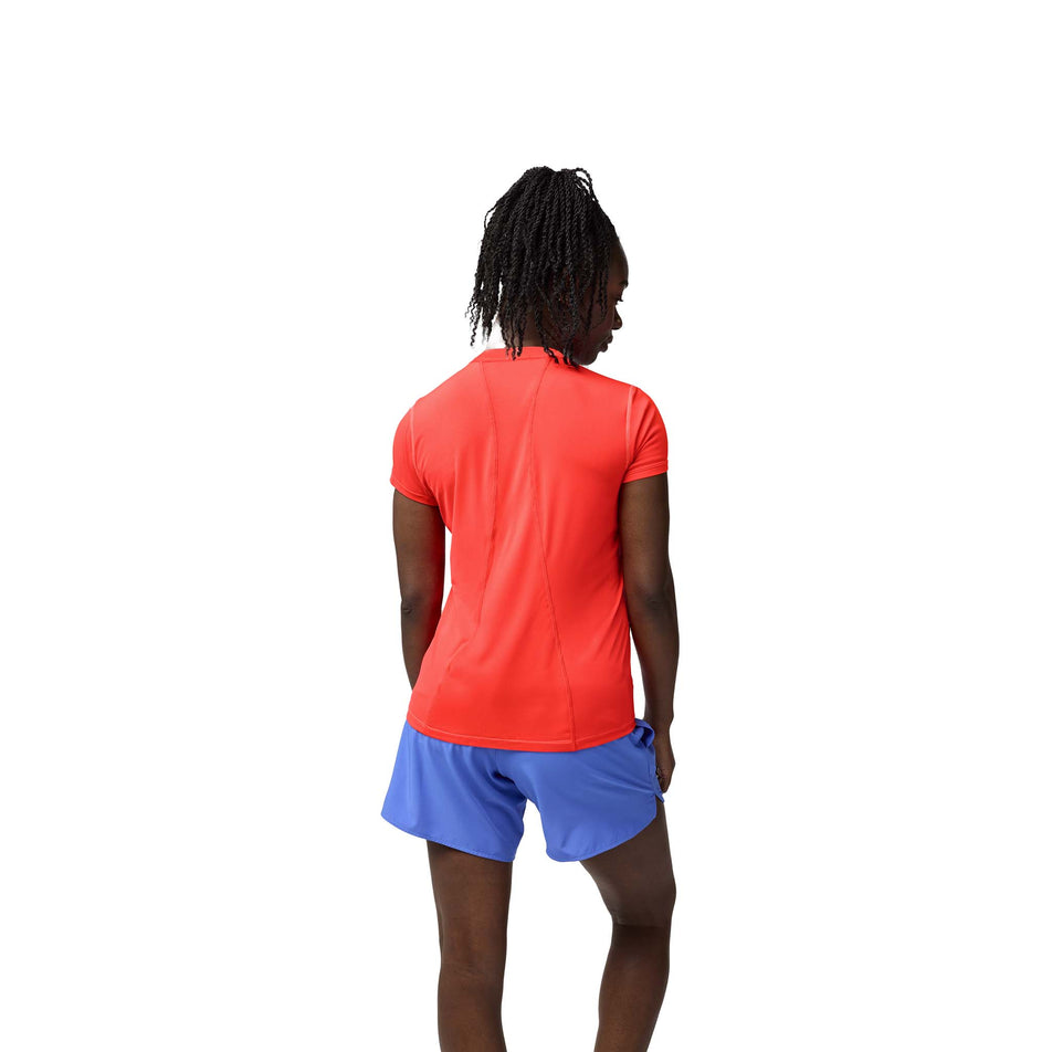 Back view of a model wearing the Brooks Women's Sprint Free Short Sleeve 3.0 in the Neo Cayenne colourway. (8575025676450)