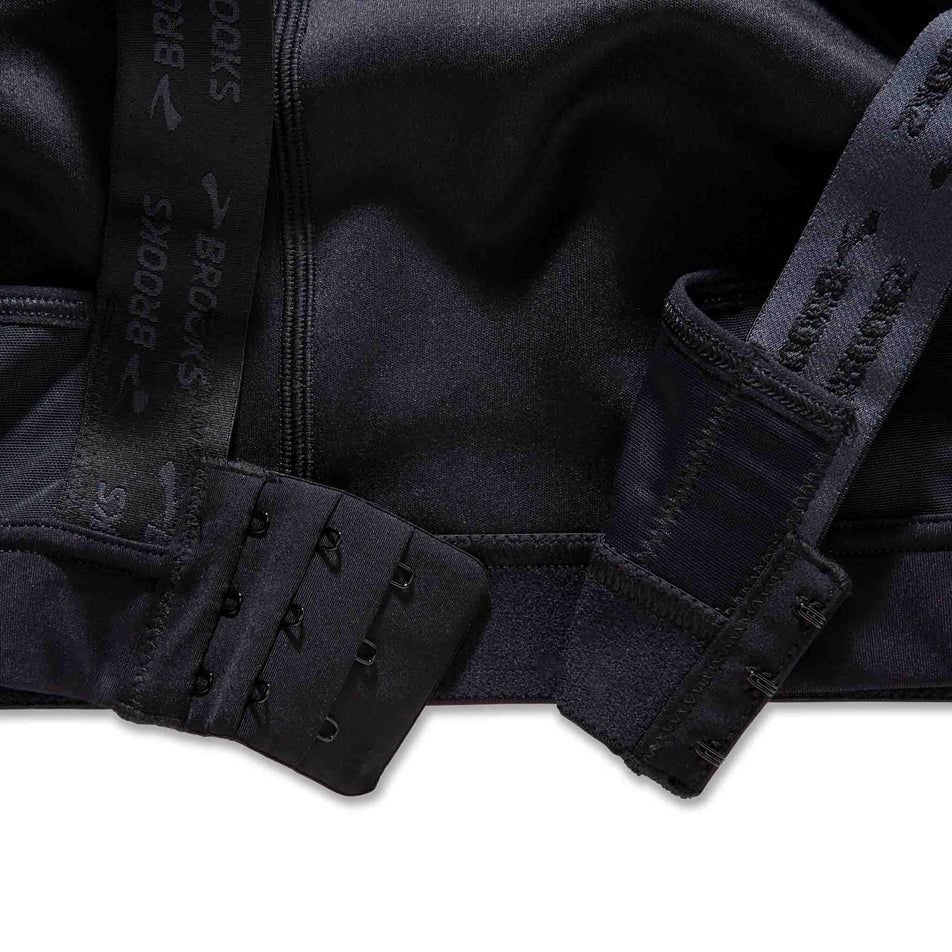 Close up of the closure system at the back of the Brooks Women's Convertible 2.0 Sports Bra in the Black colourway. (8636795551906)