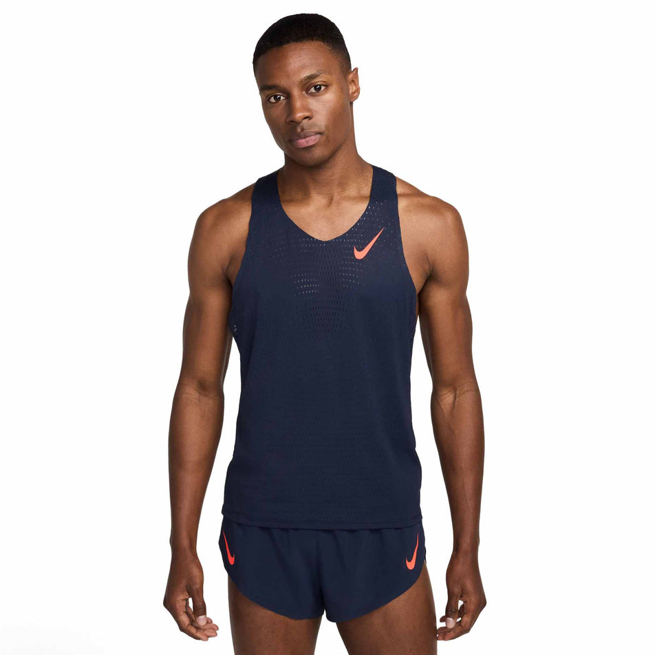 Front view of a model wearing the Nike Men's AeroSwift Dri-FIT ADV Running Singlet in the Obsidian/Bright Crimson colourway. (8574129176738)