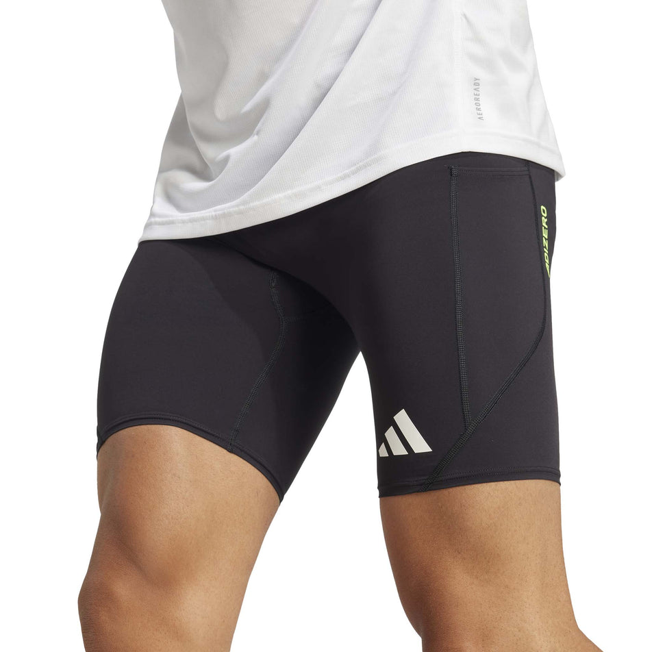 Front view of a model wearing the adidas Men's Adizero Short Tight in the Black colourway. (8566625599650)