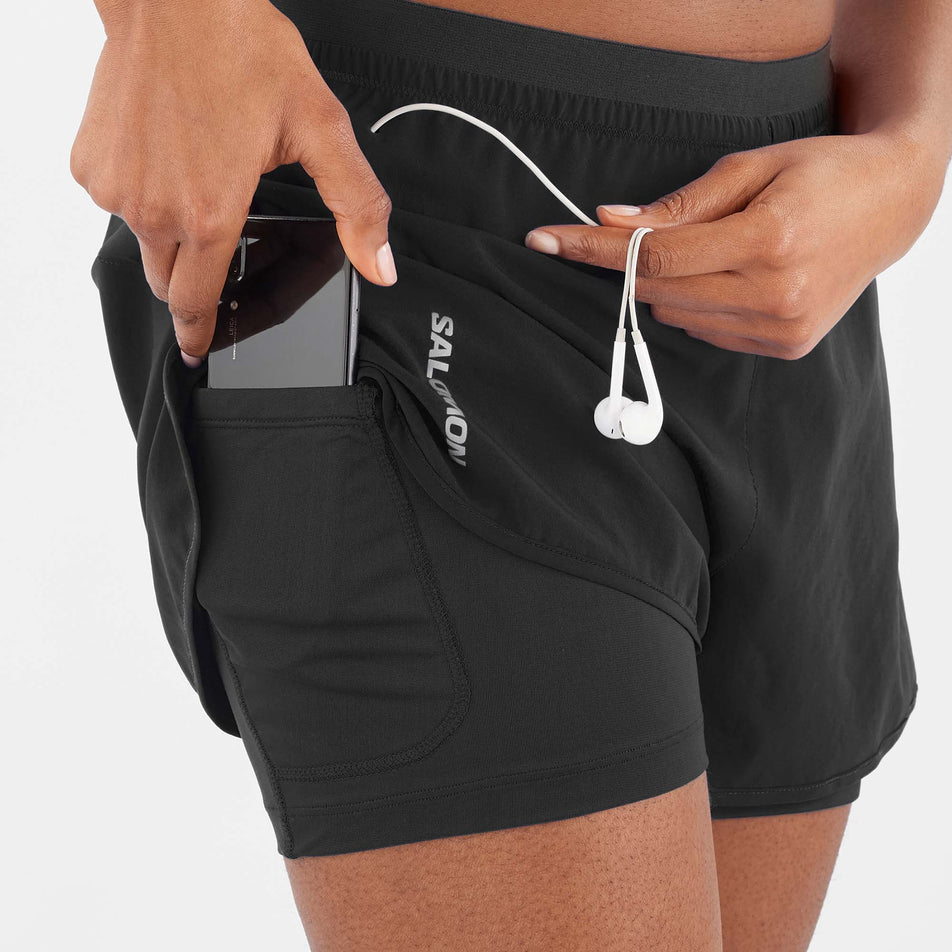 Pouch pocket view of Salomon Women's Cross 2in1 Running Shorts in black. (7766865871010)