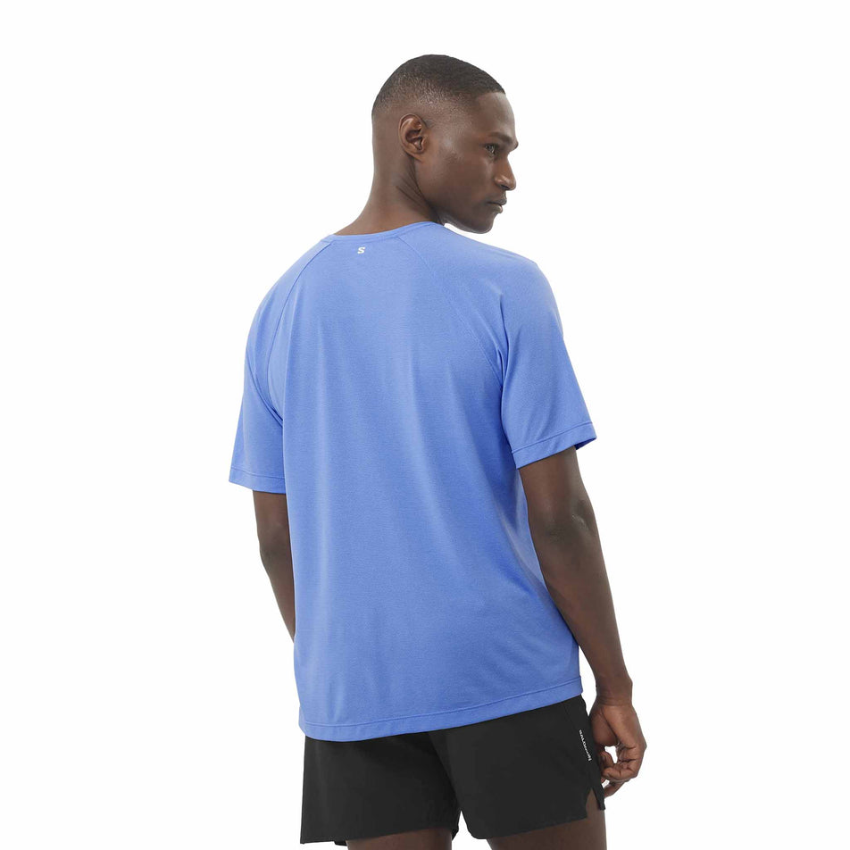 Back view of a model wearing the Salomon Men's SHKout Core Short Sleeve T-Shirt in the Ultramarine colourway. (8577971421346)