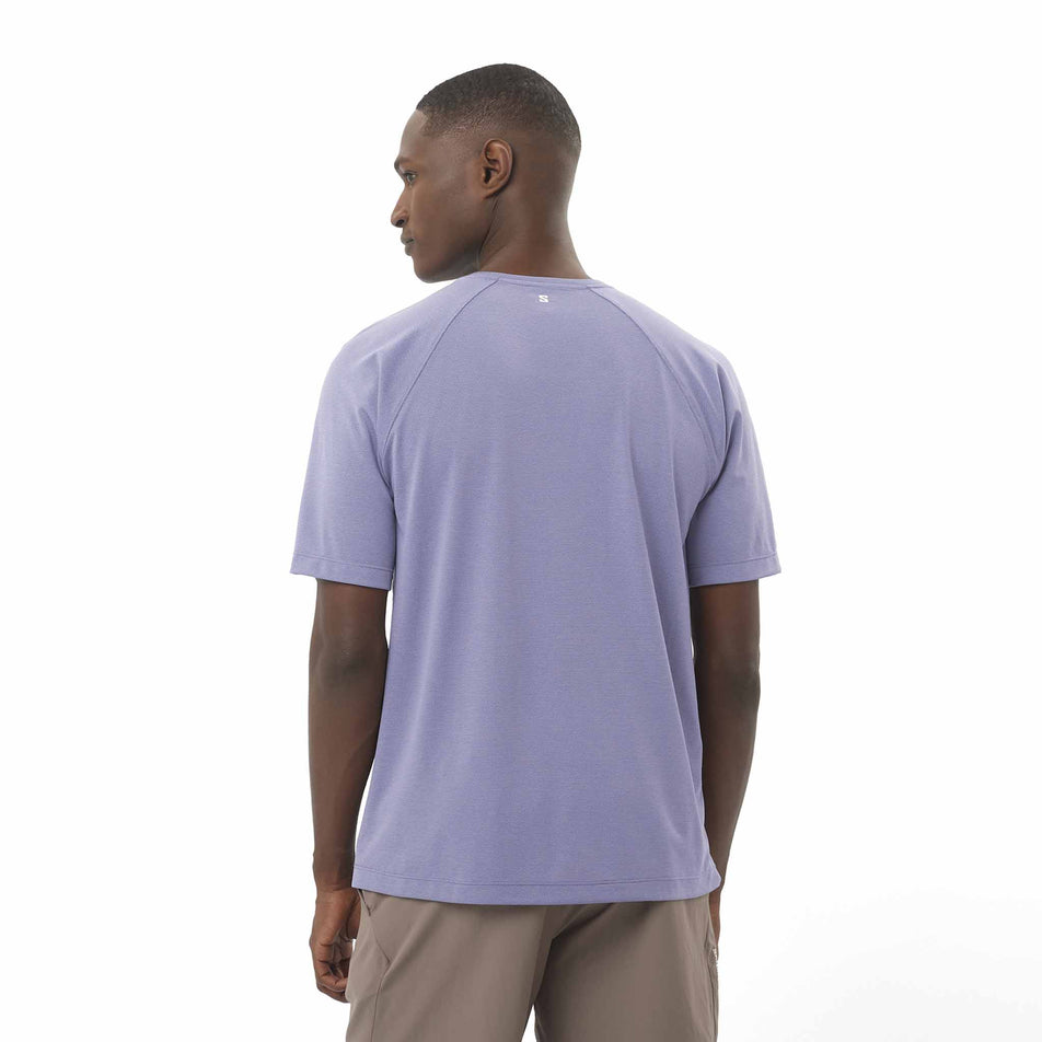 Back view of a model wearing the Salomon Men's SHKout Core Short Sleeve T-Shirt in the Blue Granite colourway. (8575590105250)