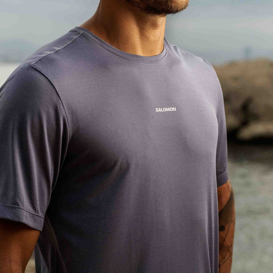 Front view of a model wearing the Salomon Men's SHKout Core Short Sleeve T-Shirt in the Blue Granite colourway. (8575590105250)