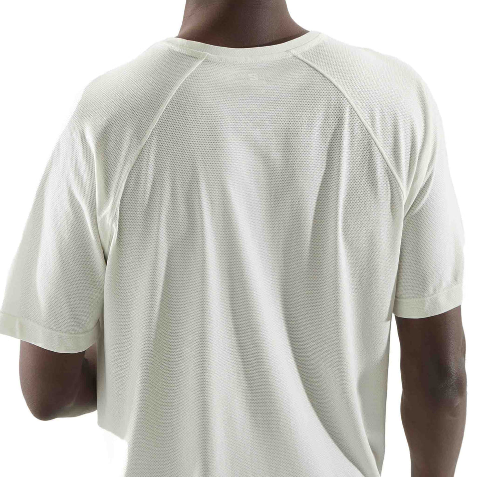 Back view of a model wearing the Salomon Men's SHKout Core Short Sleeve T-Shirt in the Icicle colourway. (8575600001186)