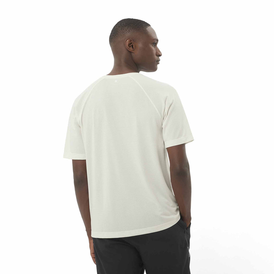 Back view of a model wearing the Salomon Men's SHKout Core Short Sleeve T-Shirt in the Icicle colourway. (8575600001186)