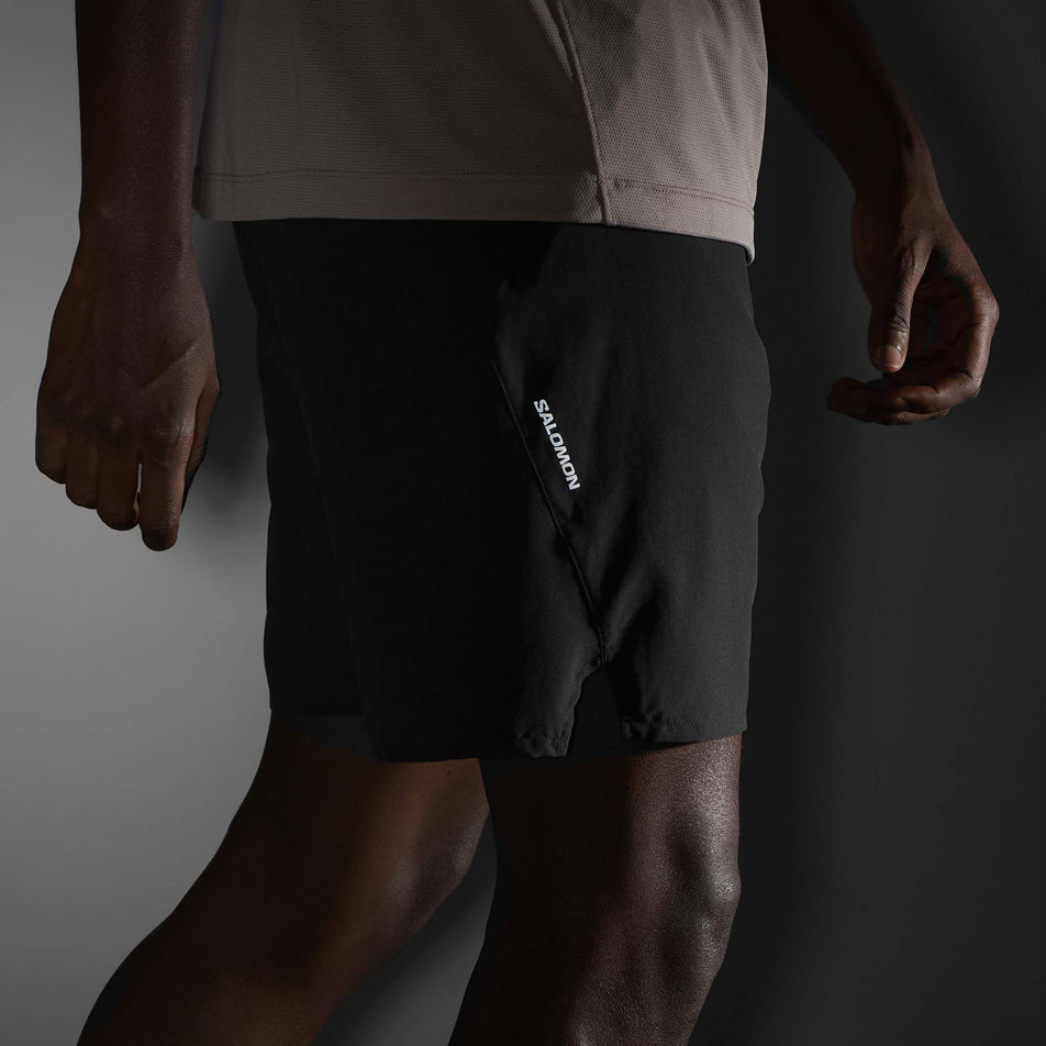 The reflective Salomon logo on the side of the Salomon Men's SHKout Core 2in1 7