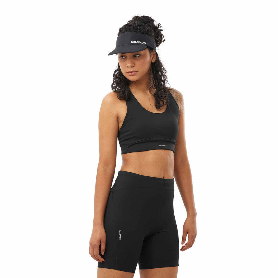 Front view of a model wearing the Salomon Women's SHKout CORE Sports Bra colourway. (8574537859234) 