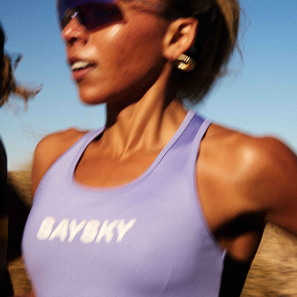 Front view of a model wearing the SAYSKY Women's Logo Combat Sports Bra in the Purple colourway. (8602075693218)