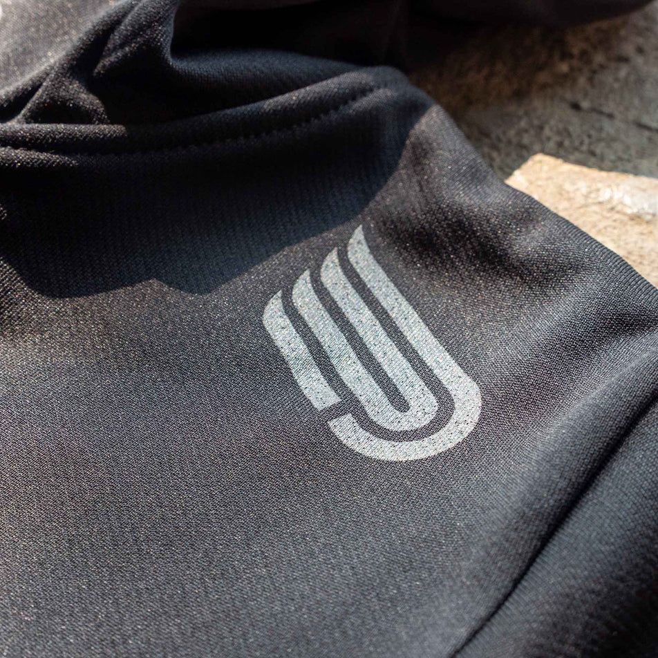 Close-up of the Pressio logo on the front of a Pressio Men's Hoodie from the range of EMF Official Licensed Merchandise (8331733696674)