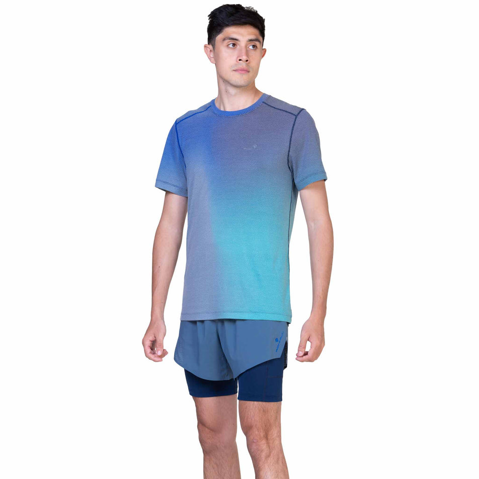 Front view of a model wearing the Ronhill Men's Tech Race Twin Short in Lake/Dark Navy colourway. (8565238464674) 