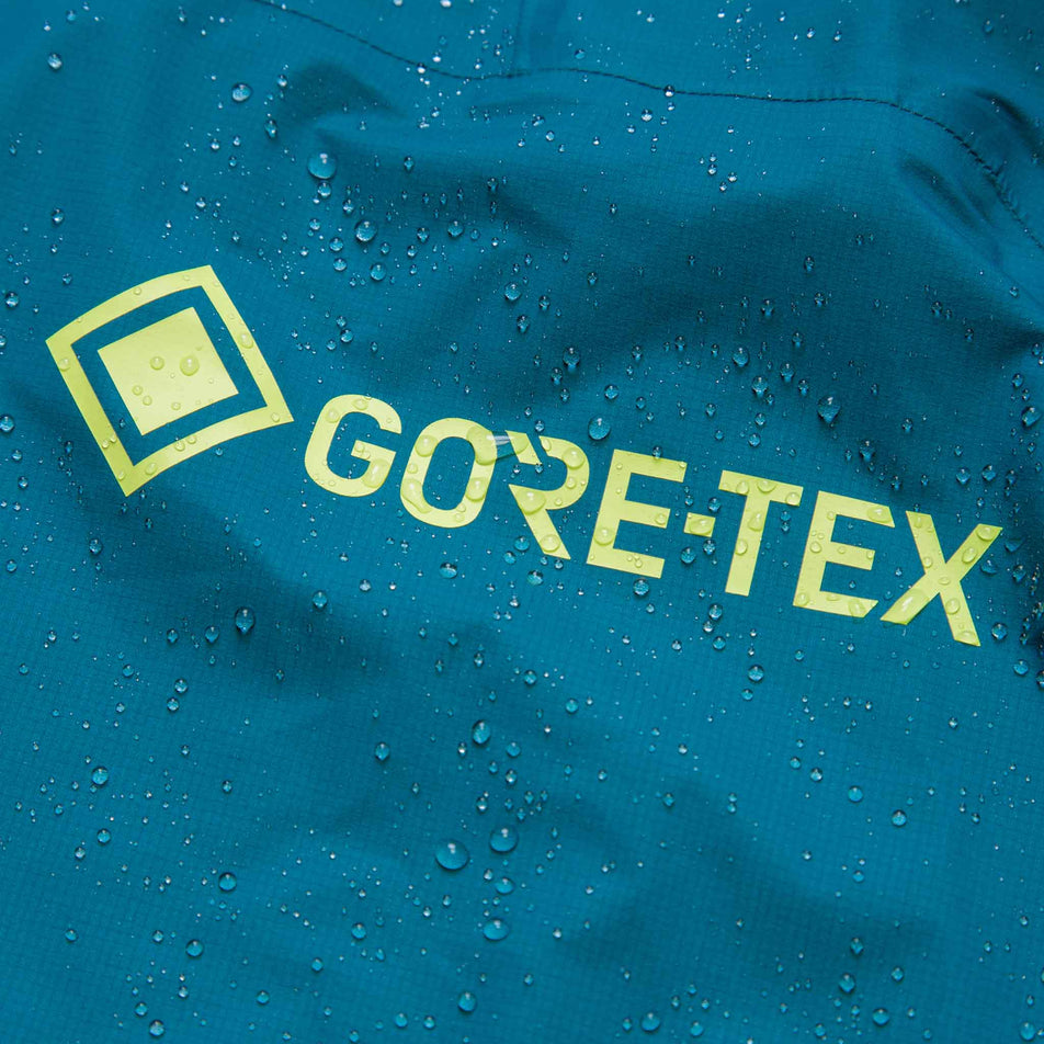 The GORE-TEX logo on a Ronhill Men's Tech GORE-TEX Mercurial Jacket. There are beads of water on the fabric. (8470598418594)