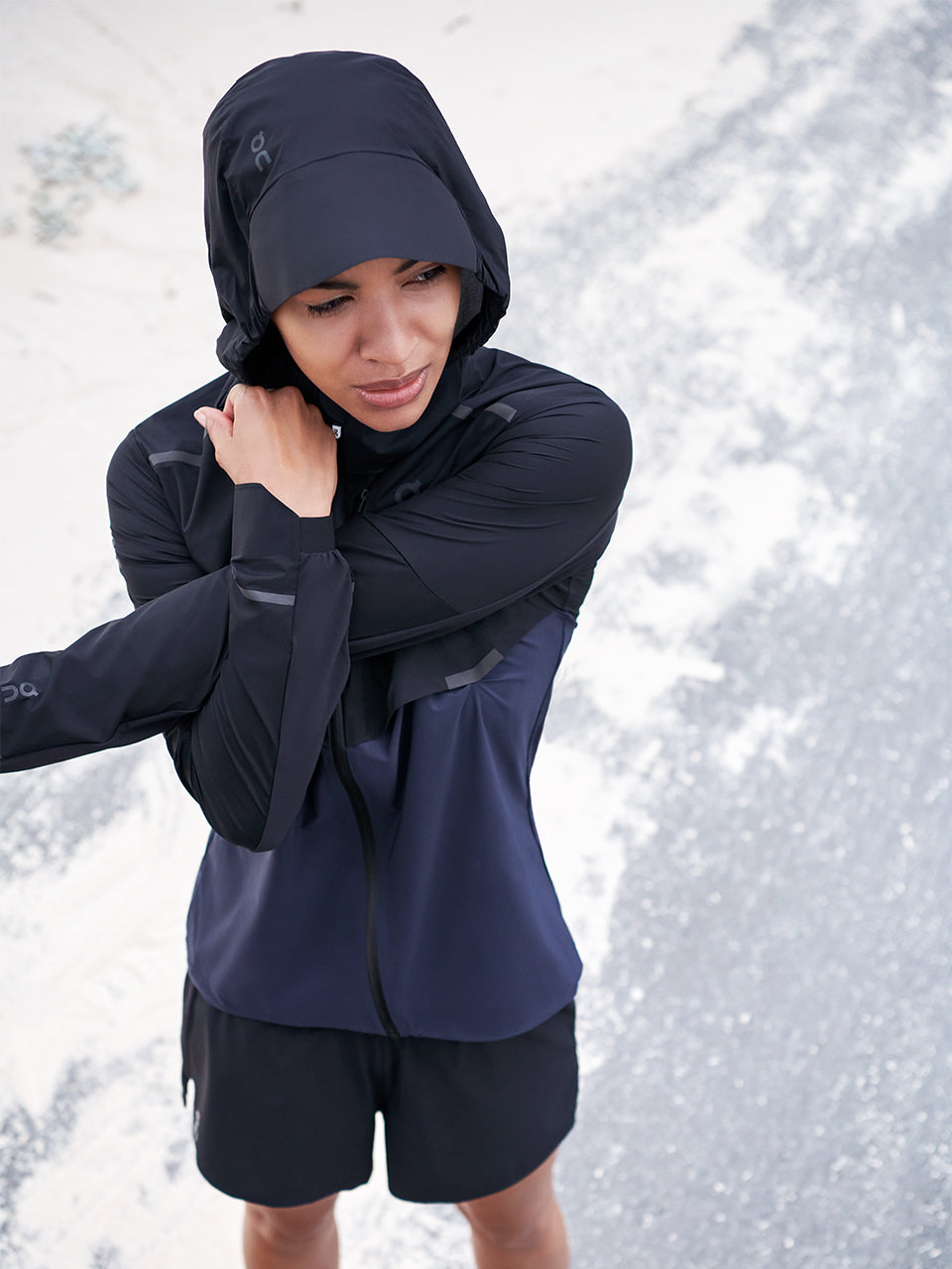 woman stretching in ON jacket