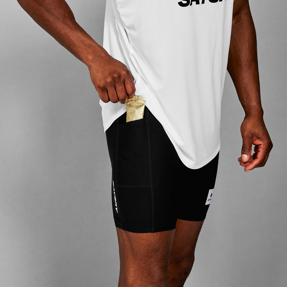 A model demonstrating the drop-in storage pocket on the side of the SAYSKY Men's Flow+ Race Short Tights 7